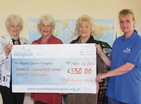 Maids hand over cheque to hospice appeal