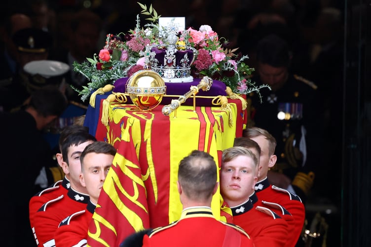 The coffin is carried out following the State Funeral of Queen Elizabeth II, held at Westminster Abbey, London. Picture date: Monday September 19, 2022.