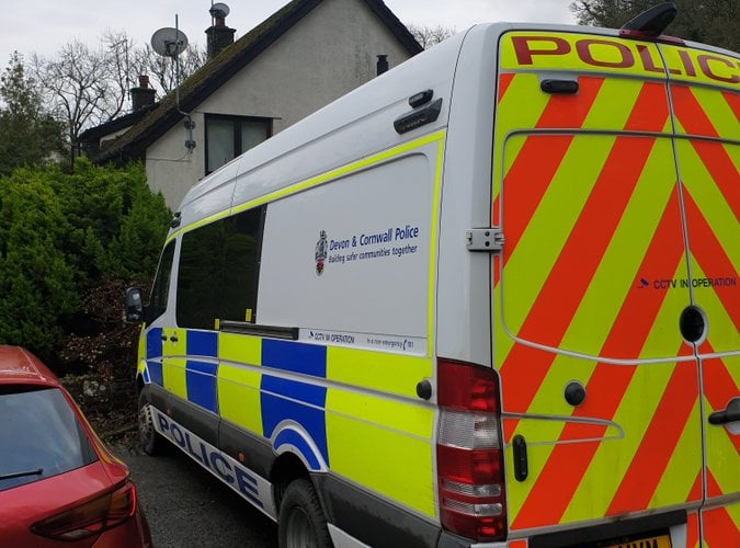 A Police van attending the property in Sticklepath