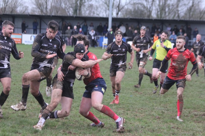 Launceston winger Archie Dinnis looks to get past former Polson Bridge favourite Shaun Crawford during Saturday's clash with Devonport Services at Polson Bridge. Picture: Paul Hamlyn