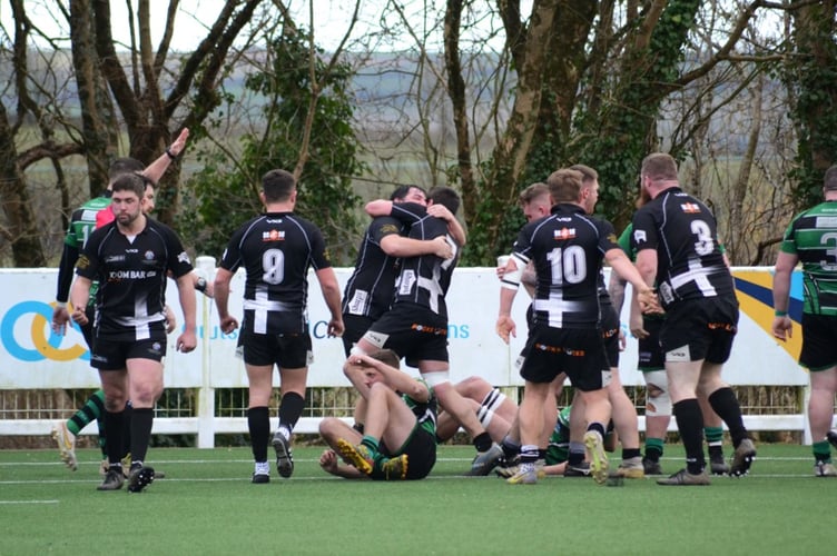 Levent Bulut and George Bone (7) celebrate Launceston's third try at Ivybridge on Saturday.