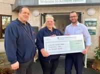 Care home make financial donation to health charity