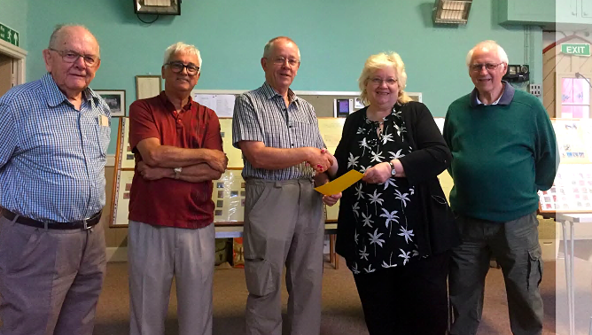 Pictured is Des Kent from the Launceston Club presenting a Certificate of Appreciation to the three visitors with Viv Sandercock looking on