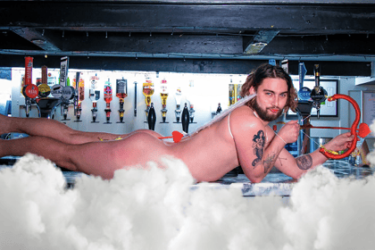 Pub strips off for Cancer Research