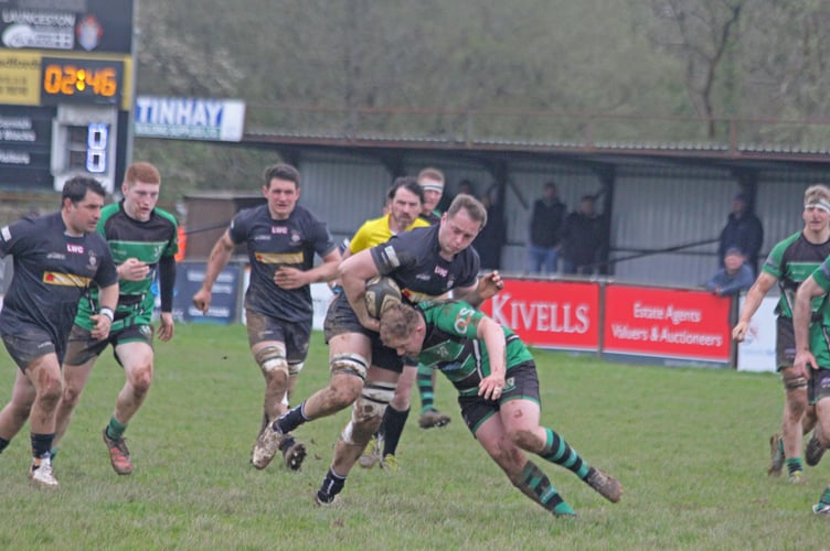 Launceston lock Dan Goldsmith looks to break through a tackle against Ivybridge.