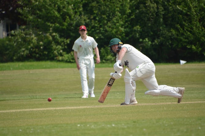 Holsworthy opener Jack Greening gets forward.