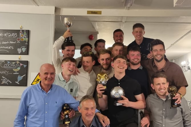 Camelford's players and management team of Reg Hambly (bottom left) and Phil Brown (bottom, second from the left) were all smiles in Wadebridge.