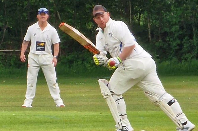 Gunnislake's Russell Holloway clips the ball into the leg-side during his half century.