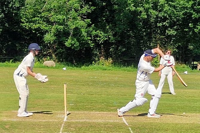 Gunnislake opener Sam Graber straight drives for four during his 54 not out on Sunday.