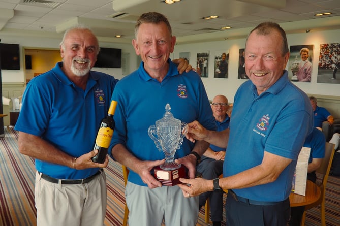 Past captain, Brian Pound (right), presenting the Jubilee Trophy to winner Mike Page together with Captai Chris de Beaufort.