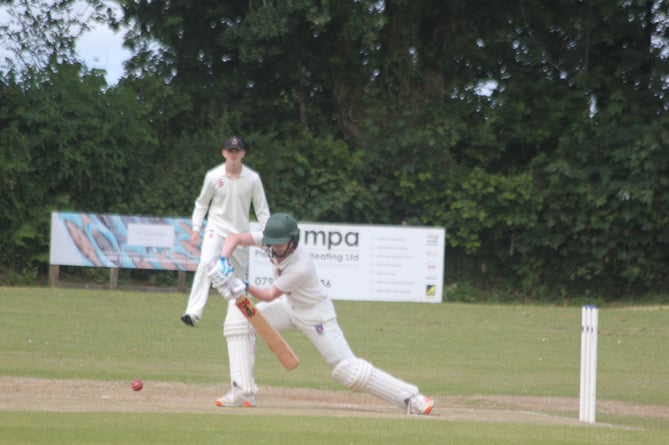 Launceston opener Finlay Worth plays forward against Grampound Road Seconds.