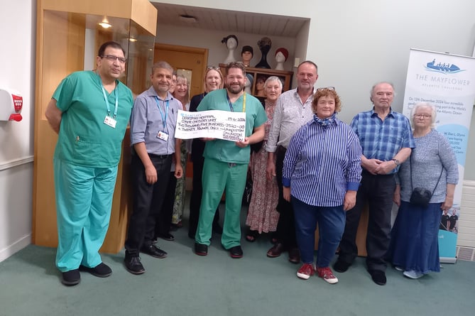 Mr Tim Hookway, gynae surgeon received the cheque alongside Dr Dubey, gynae oncology consultant; Mr Ahmed Talaat, gynae oncology lead surgeon; Nikki Calder, lead gynae oncology CNS and Debbie Wills, gynae oncology support worker