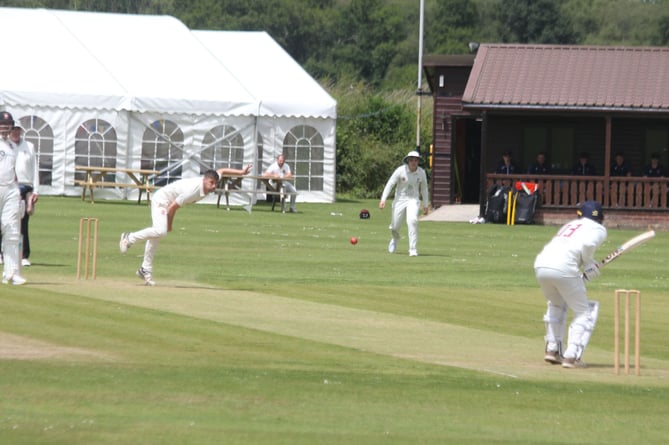 Werrington paceman Sam Hockin, pictured bowling on Saturday, took three key wickets against Penzance. Picture: Paul Hamlyn