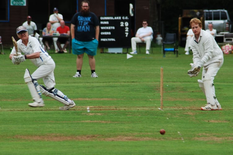 Gunnislake opener Stephen Lees plays a cut shot on his way to 30 against visiting Bugle on Saturday as wicket-keeper Paul Gribble watches on. Picture: Brian Martin/Gunnislake CC