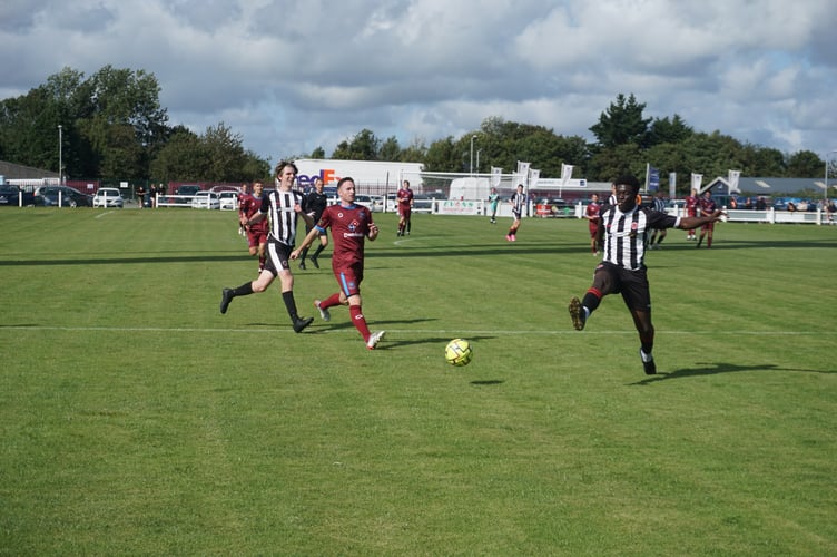 Launceston frontman Andy Watkins closes down Millbrook defender Abs Camara at Pennygillam on Saturday. Picture: Dave Deacon