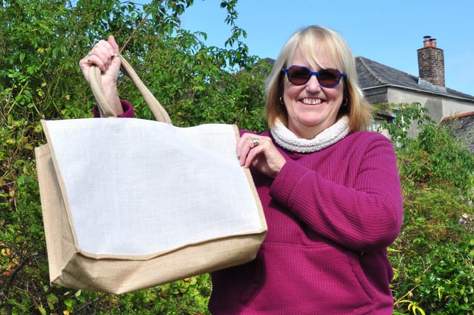 Marian Southwick with one of the tote bags