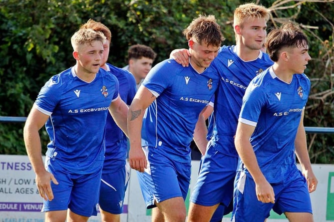 George Harvey (centre) celebrates Bude's second of the game against Truro on Saturday. Picture: Chris Pointer