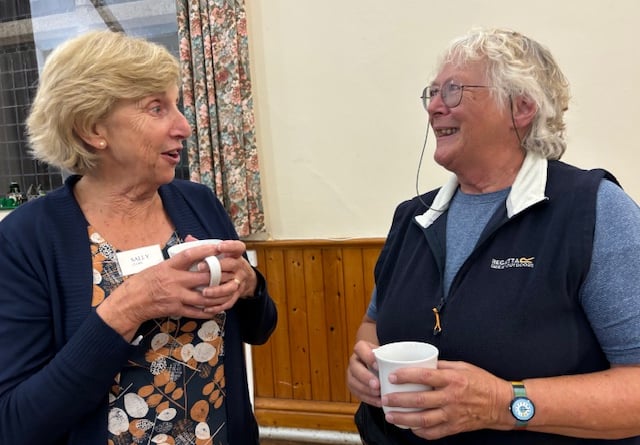 Members of Bude Women's Institute, Sally Cloke and Rosemary Lee have a chat over a cup of tea