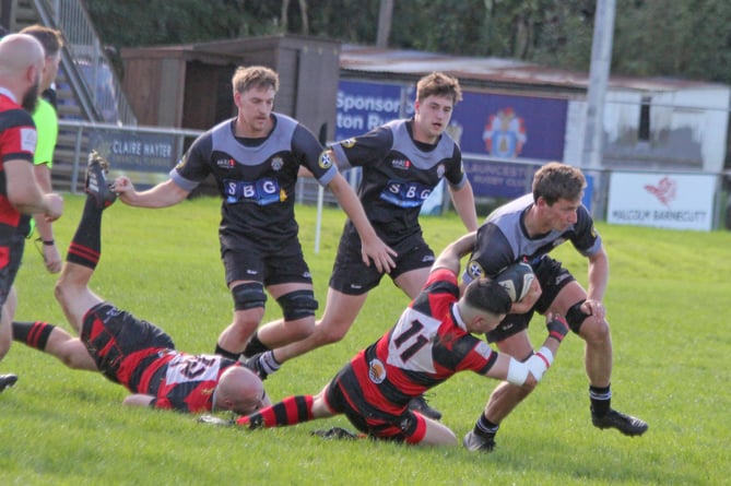 Launceston flanker Pete Bebbington looks to break through a tackle as Chris Hall (left) and Finn Stiles provide support. Picture: Paul Hamlyn