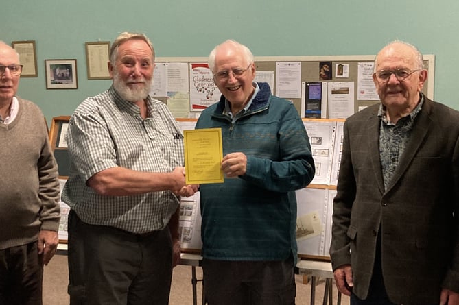 Pictured with Launceston Stamp Club members is program secretary David Hatwell presenting speaker Ian Knight with the club’s certificate of appreciation