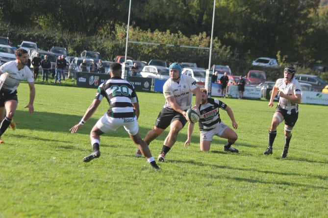 Brandon Rowley prepares to feed George Hillson to run in for Launceston's third try. Picture: Paul Hamlyn