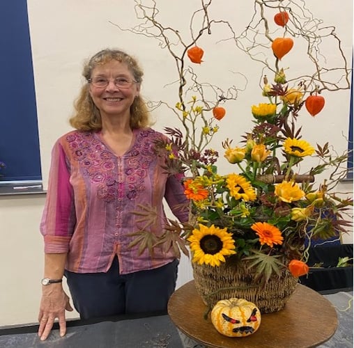 Fiona Hammond with her final arrangement from her display 'Flower Arranging with a difference: Floral Art on the Hoof' at Bude Flower Club