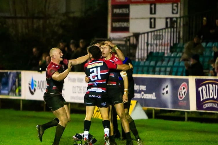 Congratulations for try-scorer Arthur Relton from Harry Yates (left) and Dan Hiscocks (number 21). Picture: Brian Tempest