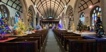 Church gets festive with nearly 100 Christmas trees