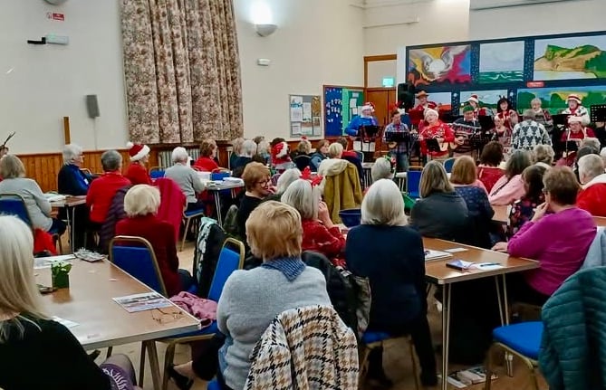 Members of Bude Women's Institute enjoying the entertainment at their Christmas Party